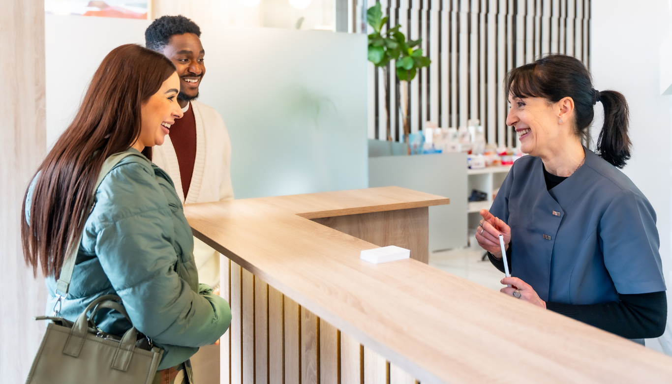 Receptionist scheduling a same-day emergency dental visit